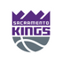 Logo of the Sacramento Kings featuring a stylized crown above the team name in purple and white. A gray basketball design appears at the bottom on a shield-shaped background.