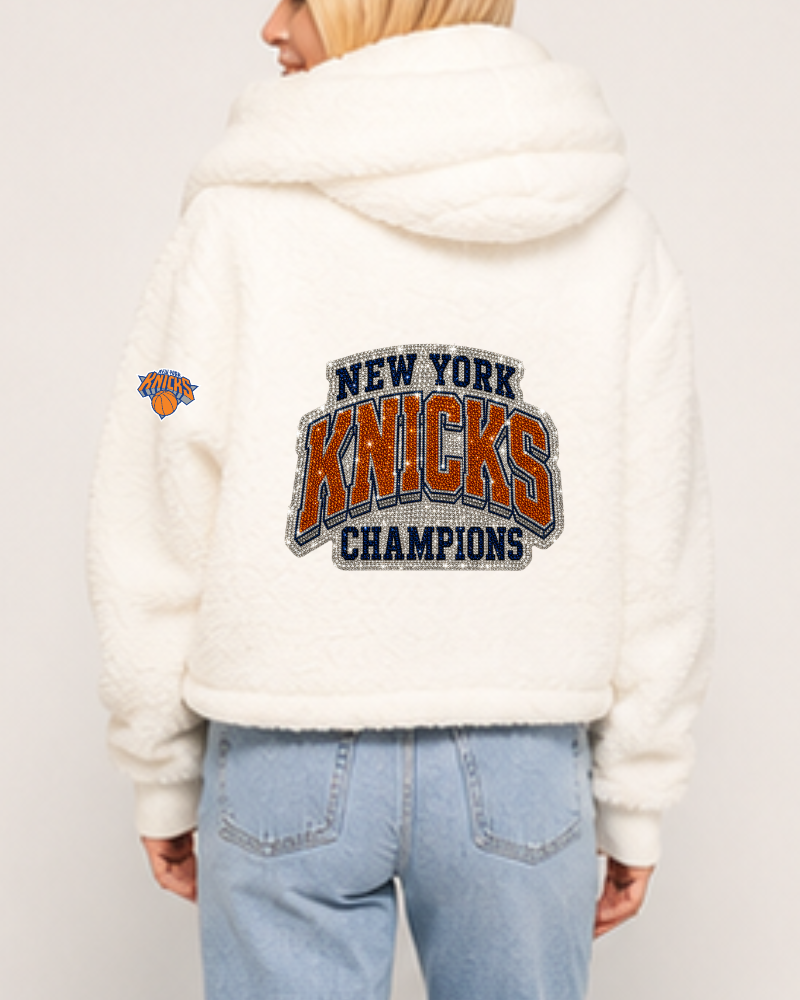 Person wearing a white hoodie with 'New York Knicks Champions' text and logo on the back.