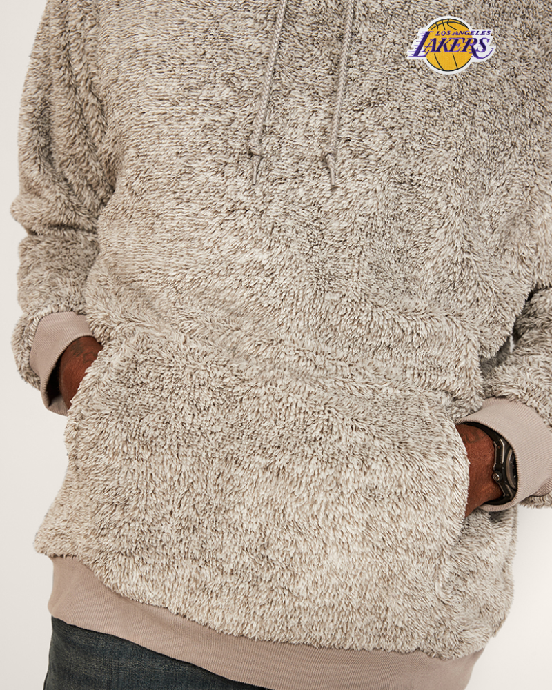 grey sherpa pullover with a lakers logo on a light background