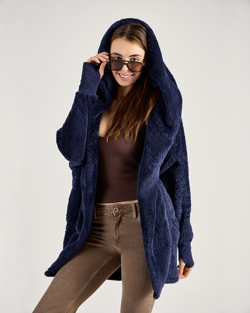 Woman wearing a blue hooded cardigan on a plain background|Model: 5'11" in size XS/S