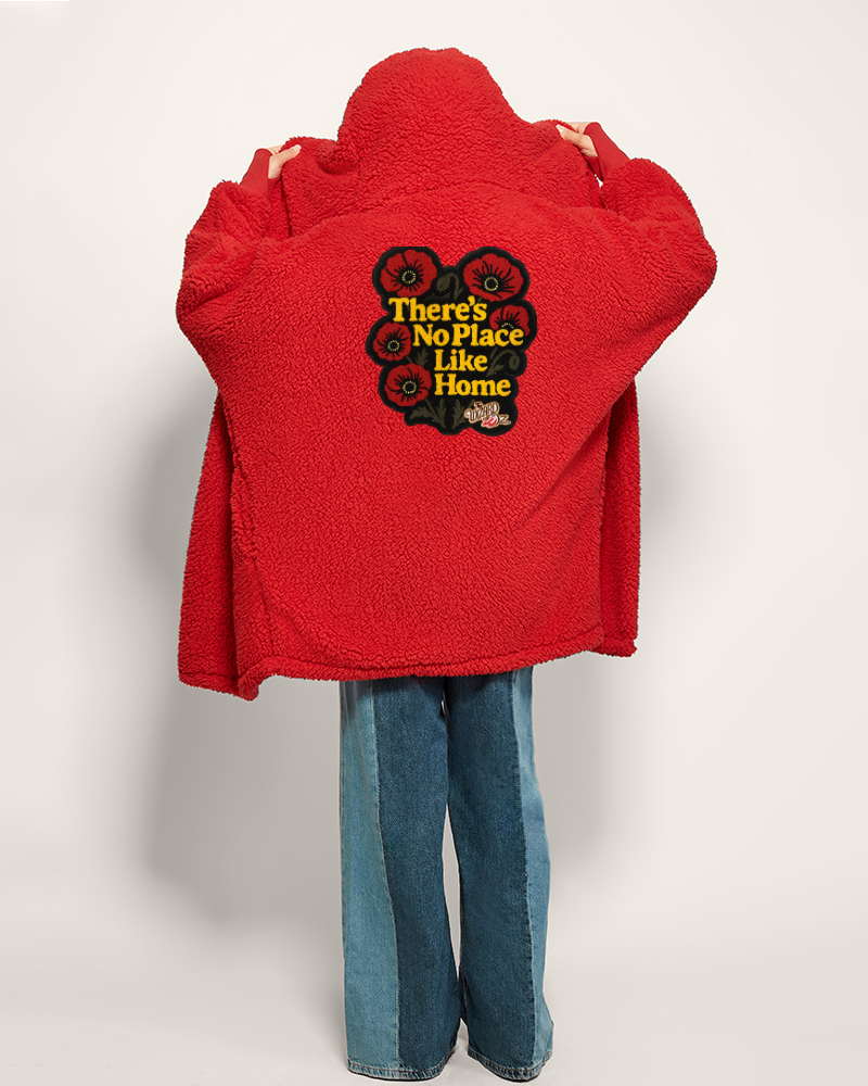 Red jacket with a graphic design and text on the back, worn by a person against a white background
