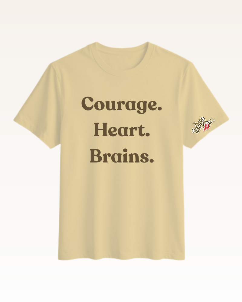 Beige t-shirt with text 'Courage. Heart. Brains.' on a white background