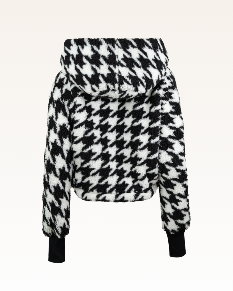 Black and white houndstooth patterned jacket on a white background
