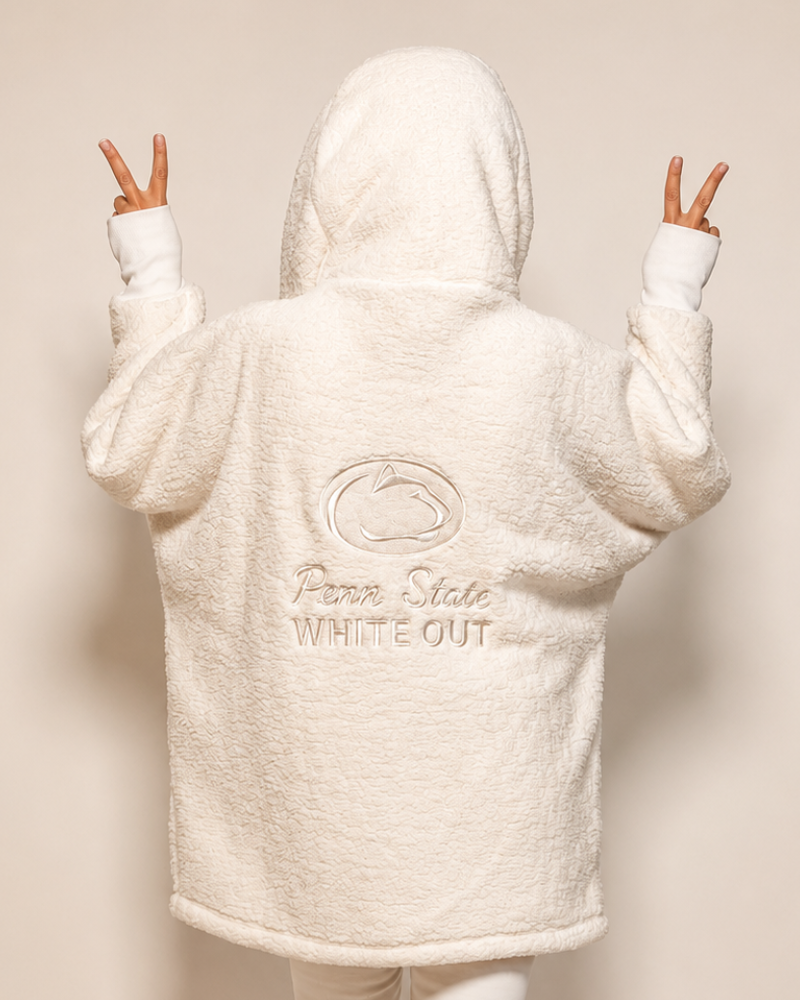 White fleece hoodie with 'Penn State White Out' text on the back, worn by a person making peace signs.