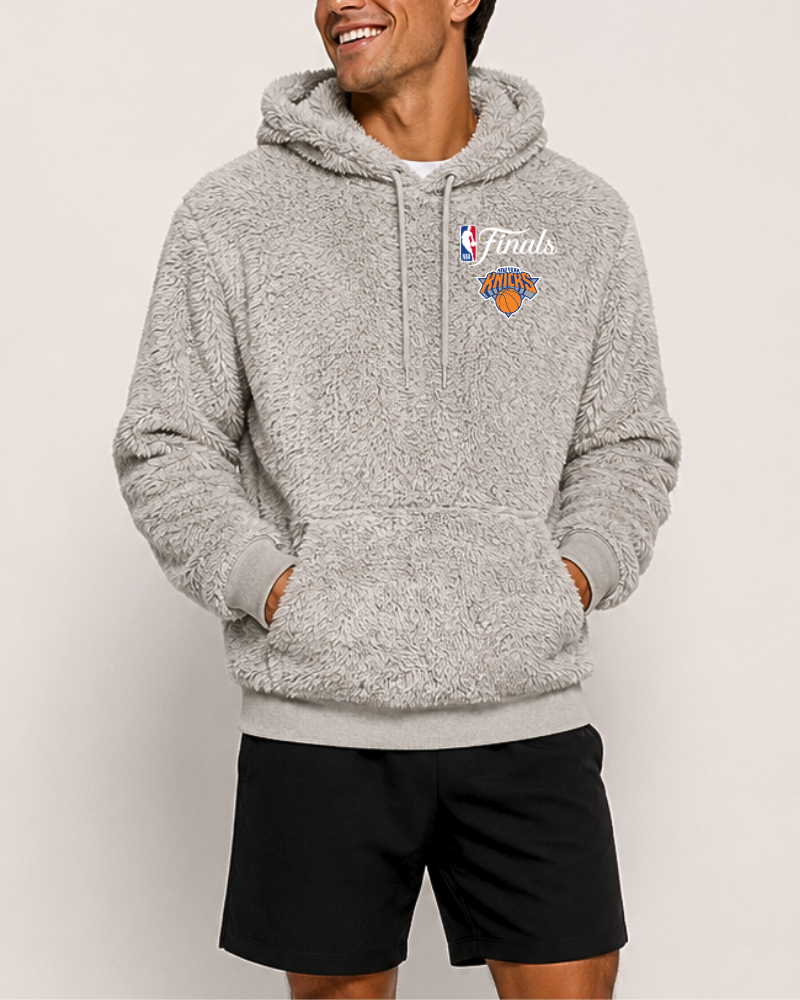 Person wearing a gray fleece hoodie with a logo on a white background