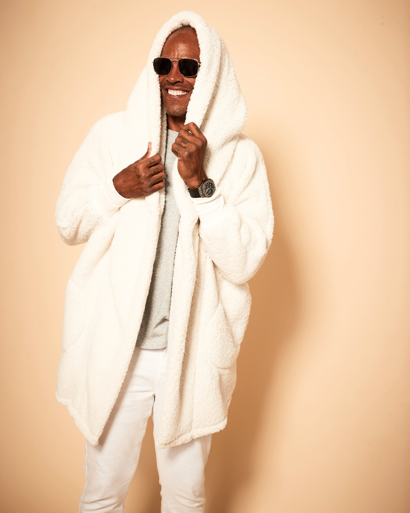 man wearing ivory sherpa lounger and sunglasses against beige background