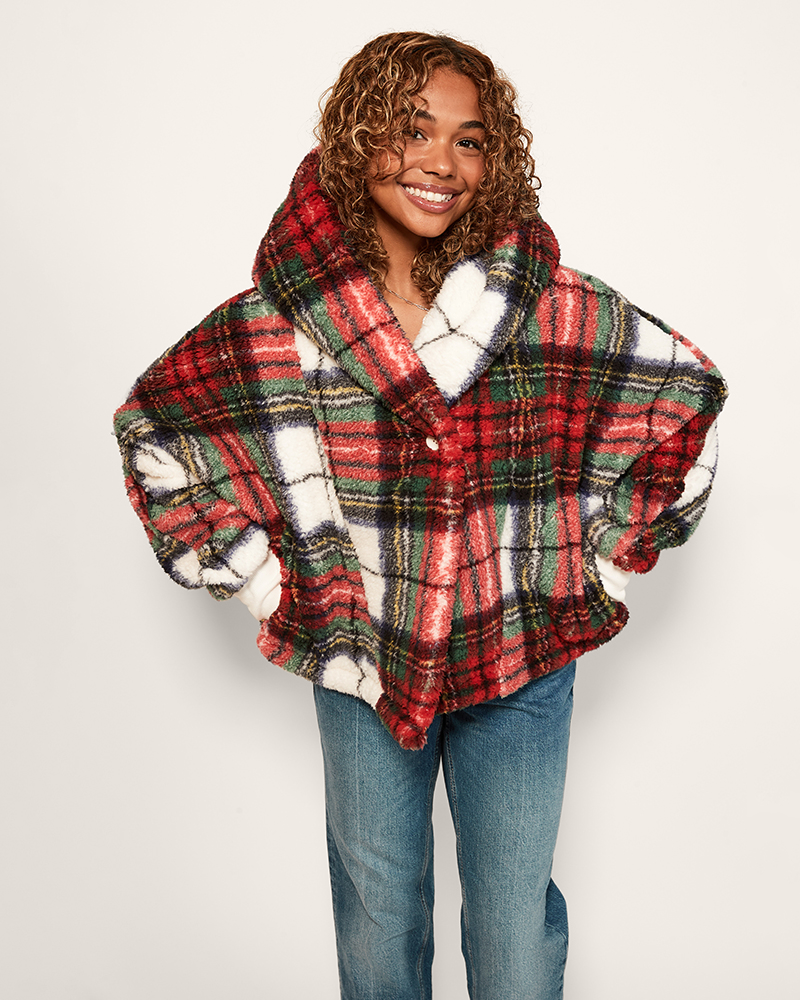 Person wearing a plaid lounger with a hood on a white background