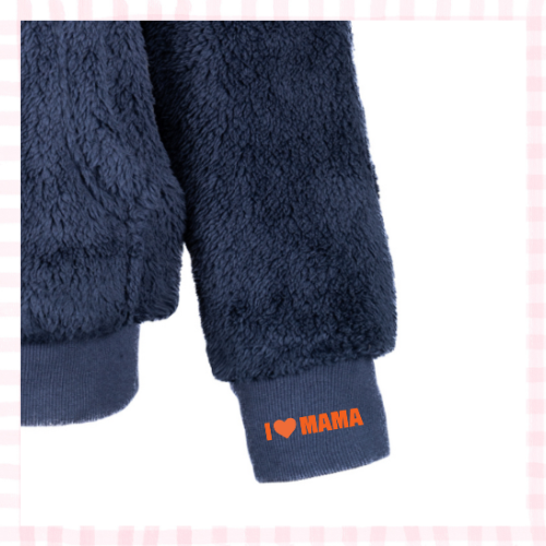 Close-up of a navy sherpa sweatshirt cuff with 'I <3 Mama" a stitched in delicate thread.