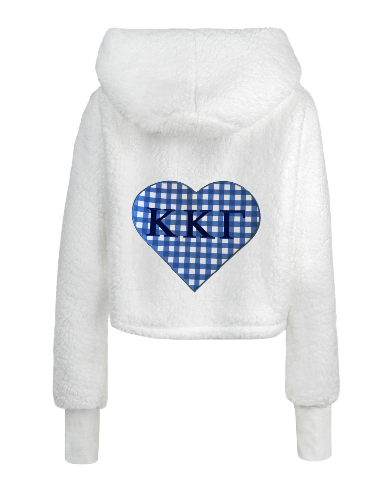 White sherpa fleece cropped hoodie with a blue and white gingham heart graphic on the back featuring the letters 'Kappa Kappa Gamma' in navy blue.