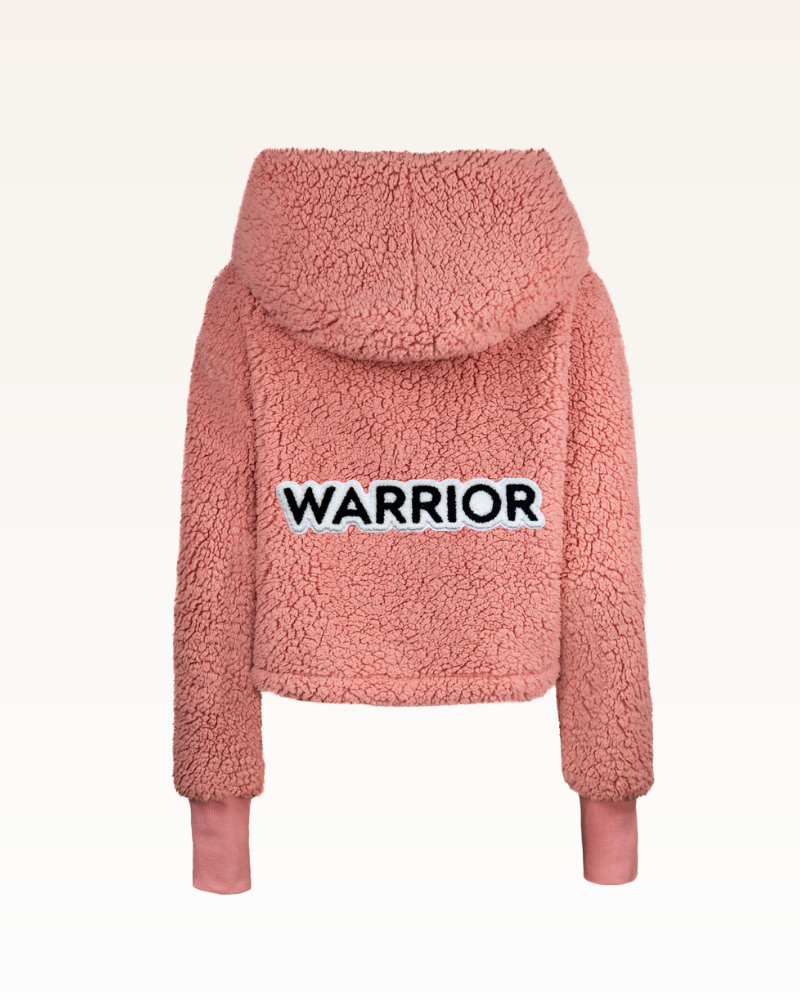 Pink sherpa jacket with 'WARRIOR' text on a white background