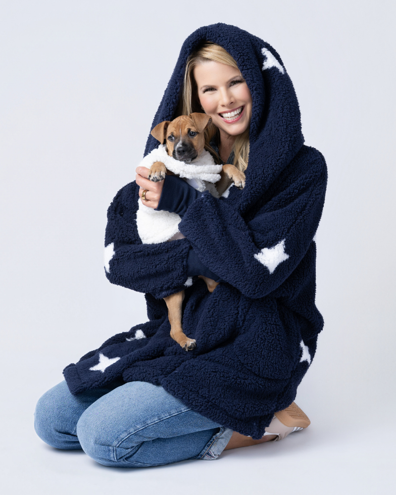 woman wearing a sherpa holding dog wearing a sherpa pet jacket