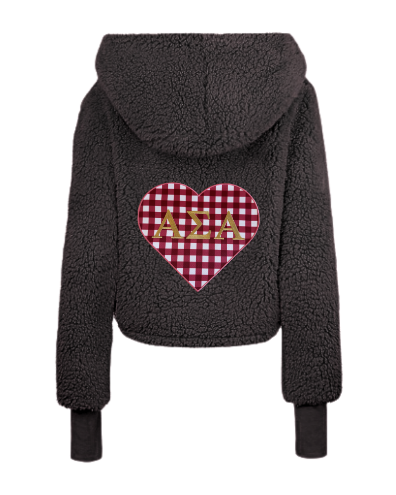 A black sherpa fleece cropped hoodie shown from the back, featuring a red and white gingham heart patch with the Greek letters 'Αlpha Sigma Alpha' in gold