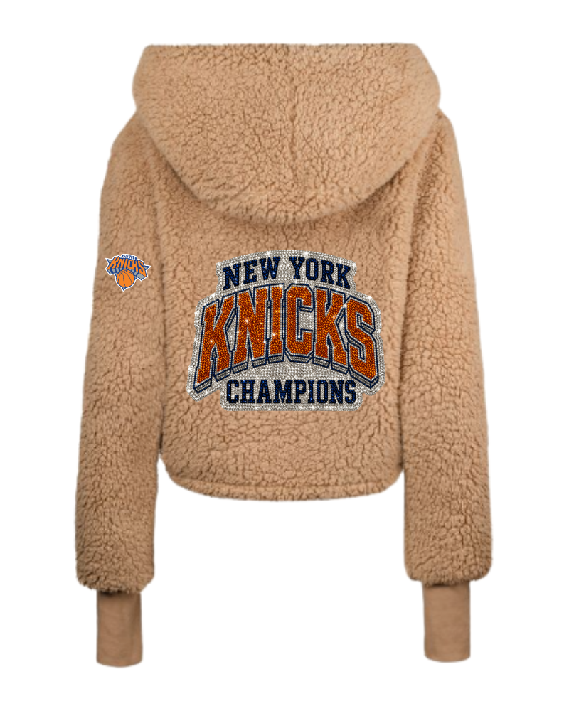 Beige sherpa jacket with New York Knicks logo on a white background