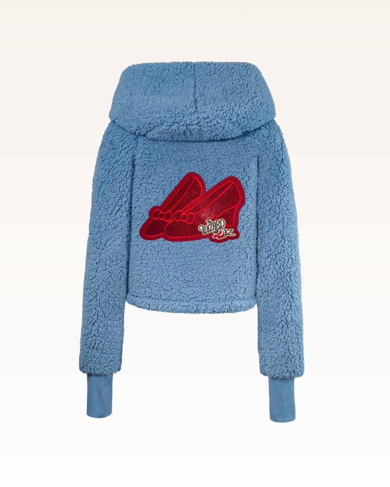 Blue fleece jacket with a red logo on the back against a white background