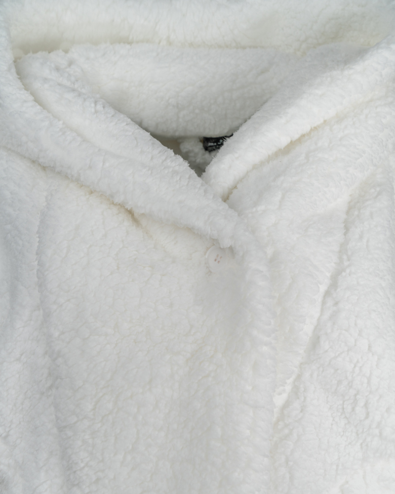 Close-up of a white sherpa fabric surface
