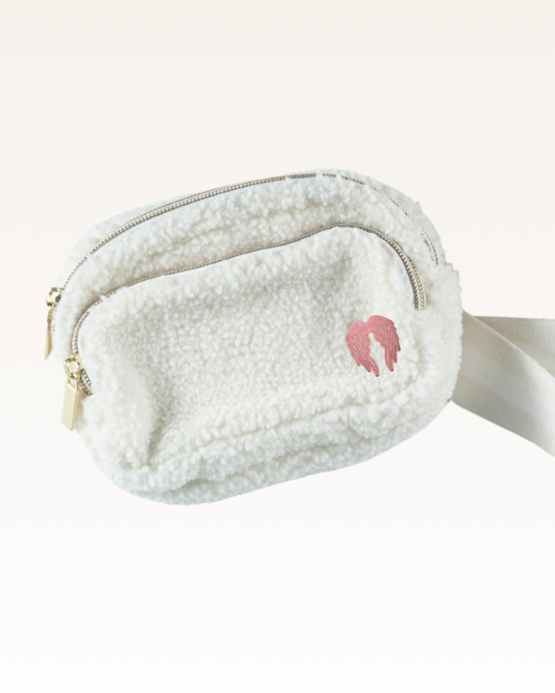 White fleece waist bag with a pink angel wings logo on a white background
