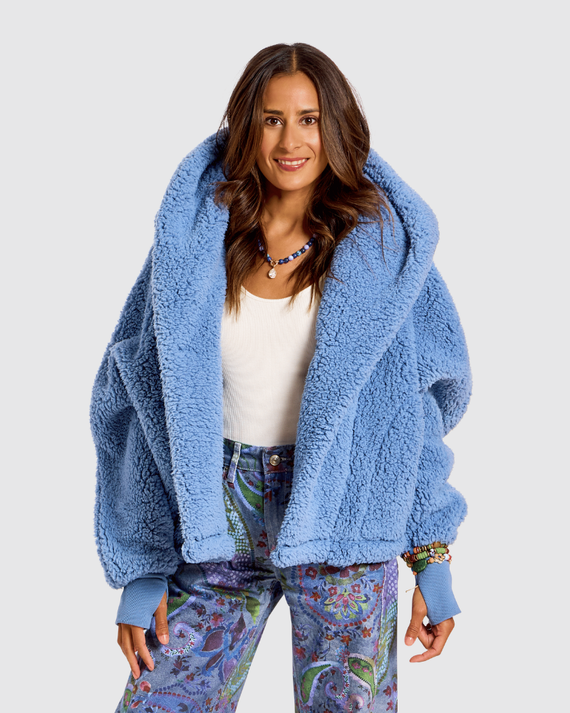 Model wearing a light blue fuzzy sherpa jacket against a white studio background |Model is 5'4" wearing size XS/S