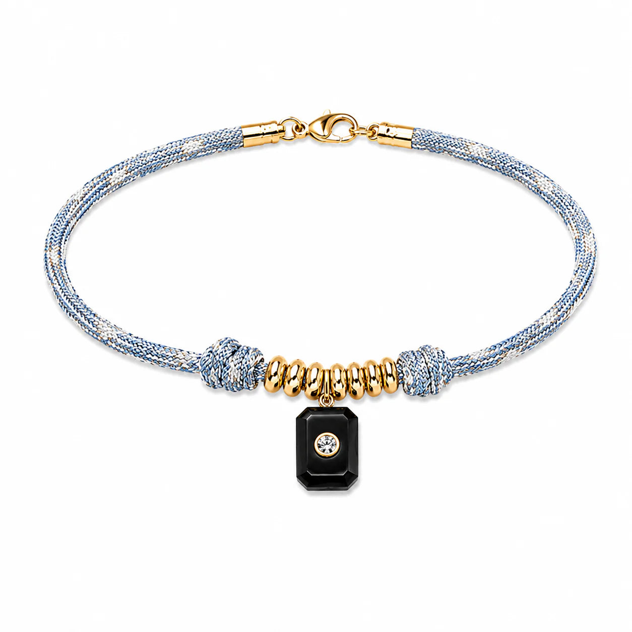 Bracelet with gold and black beads on a white background