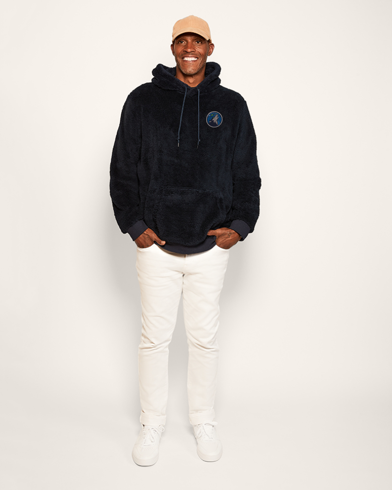 navy fleece hoodie with a timberwolves logo on the chest against a white background