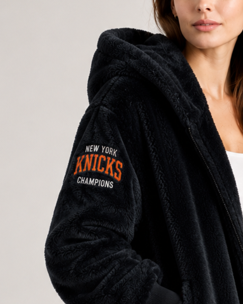 Black lounger with 'New York Knicks Champions' text on a plain background