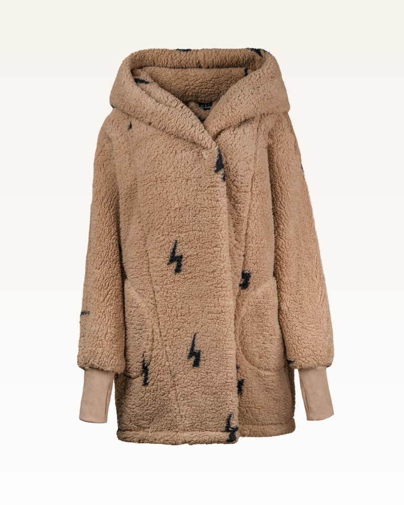 Beige sherpa jacket with black lightning bolts on a white background