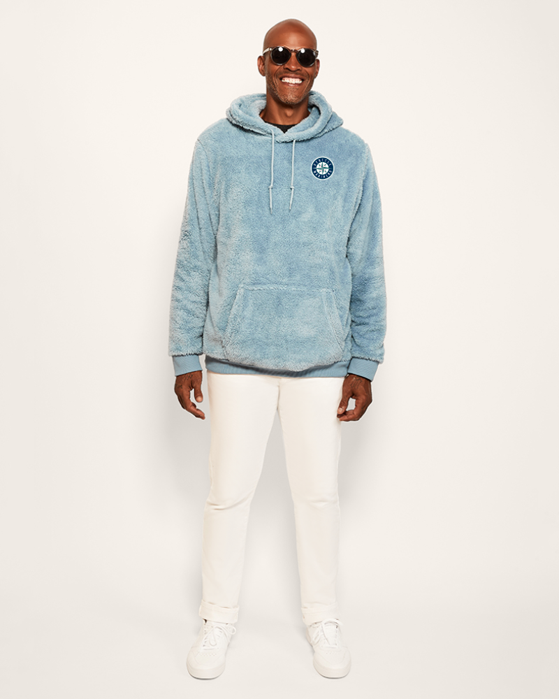 Man wearing a blue hoodie with a seattle mariners logo on a white background