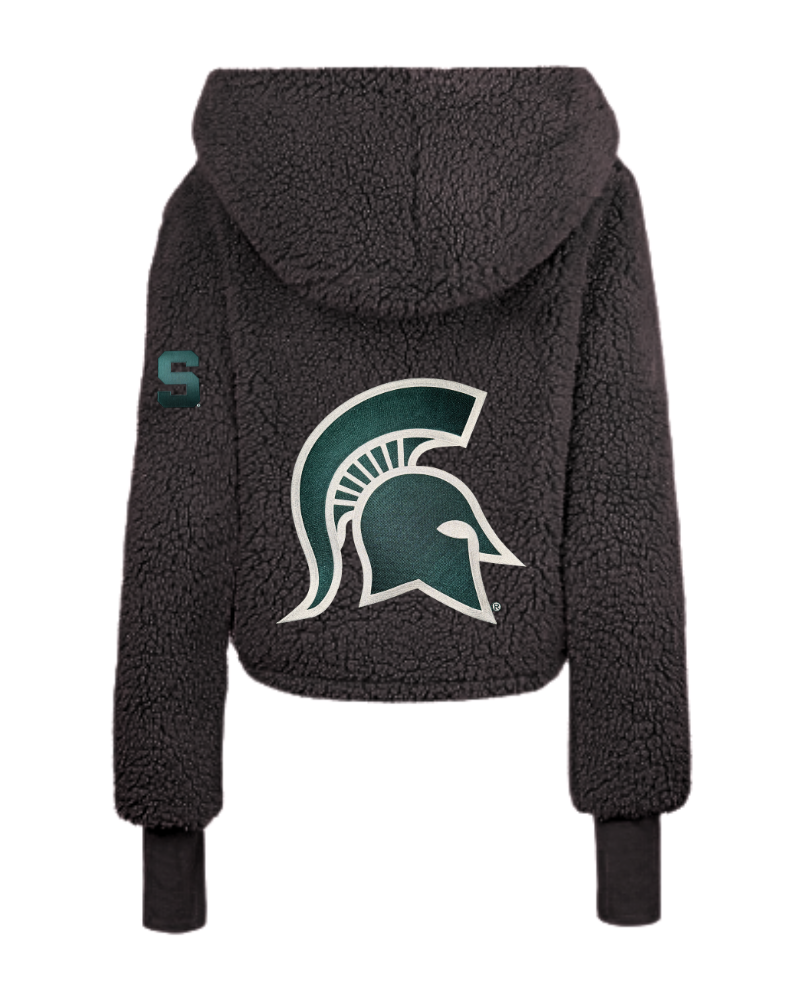 A black sherpa fleece cropped hoodie featuring the Michigan State Spartans helmet logo on the back in green and white, with a small green 'S' patch on the left sleeve.