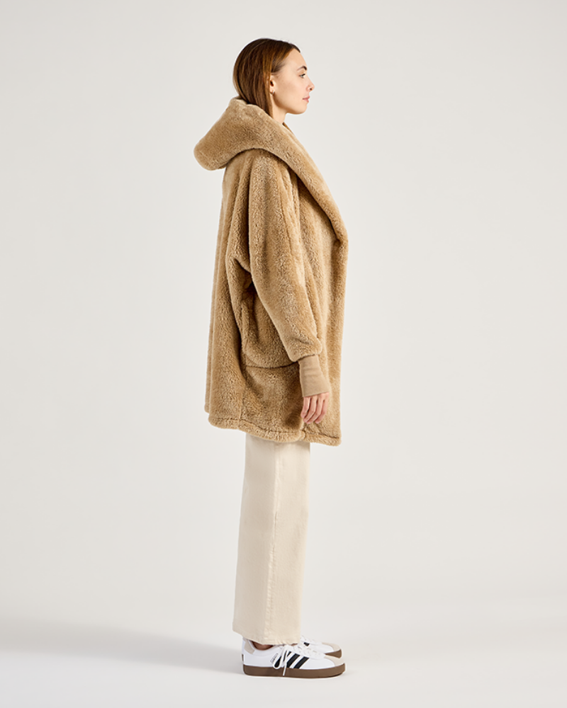 Person wearing a beige hooded coat on a white background|Model: 5'11" in size XS/S