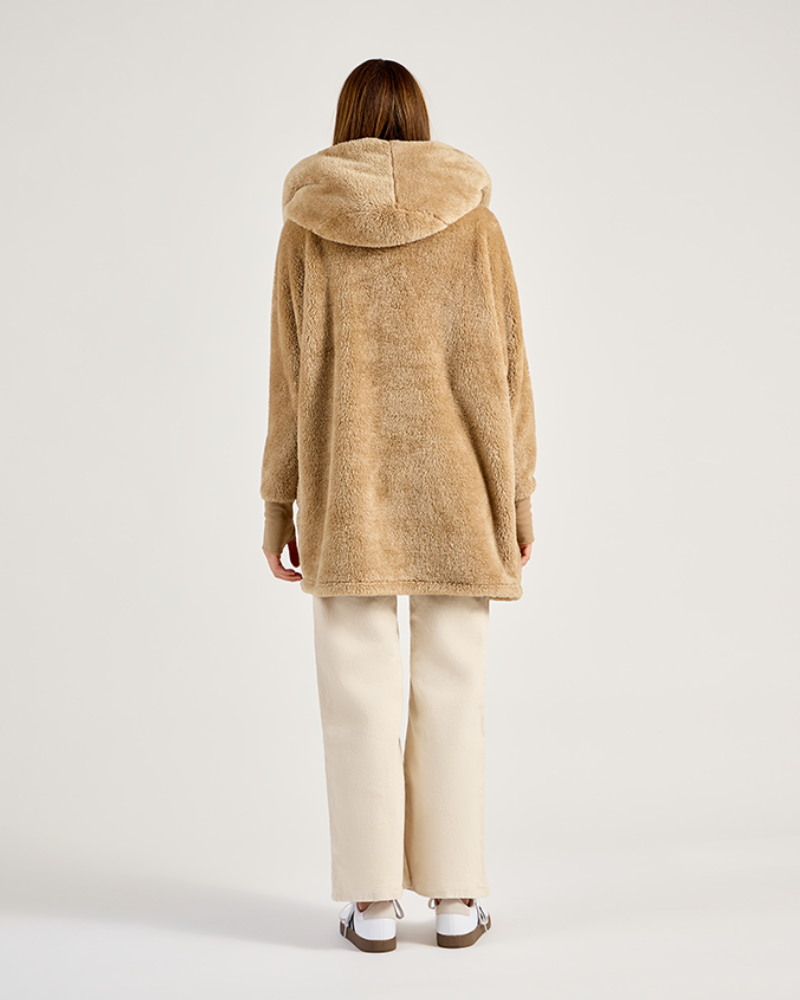 Person wearing a beige hooded coat on a white background|Model: 5'11" in size XS/S