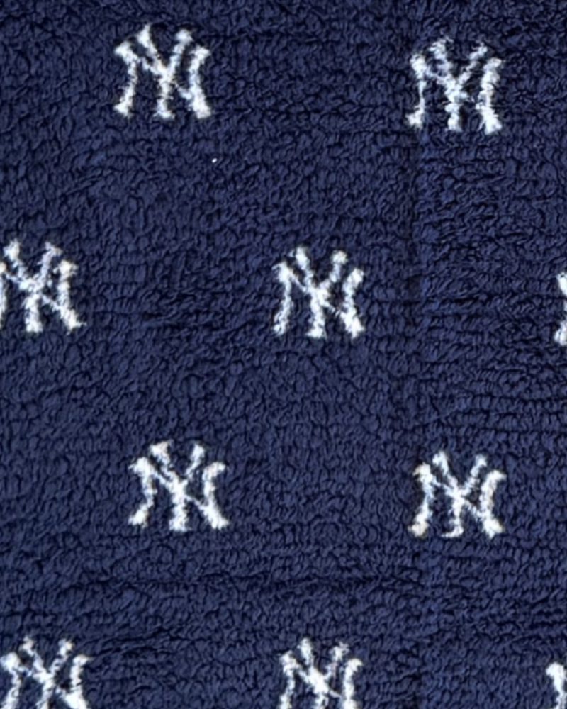 Navy blue fabric with white New York Yankees logo pattern