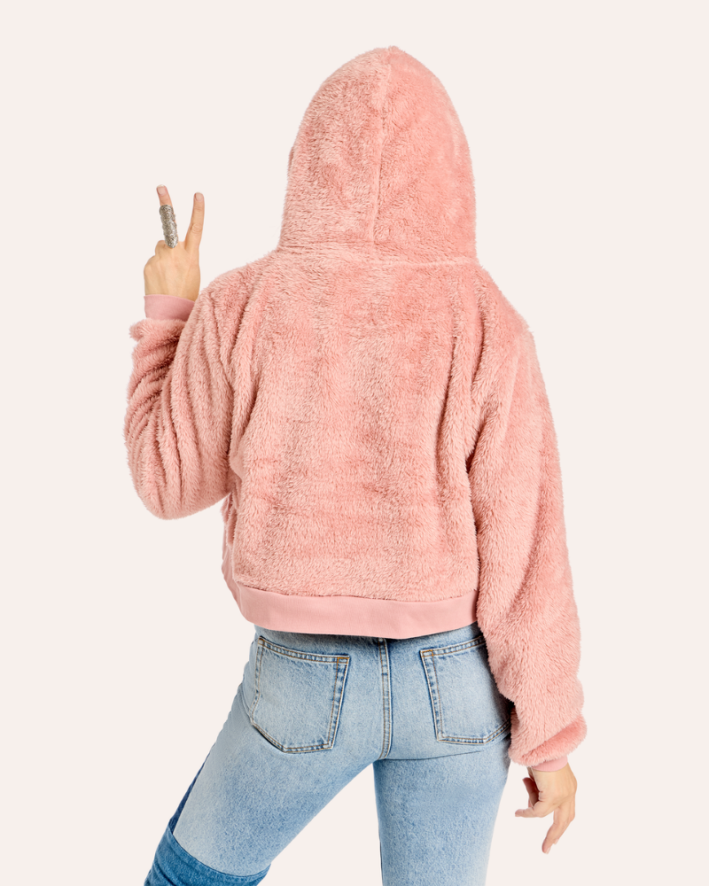 WOMAN WEARING CROPPED FUZZY PINK HOODIE