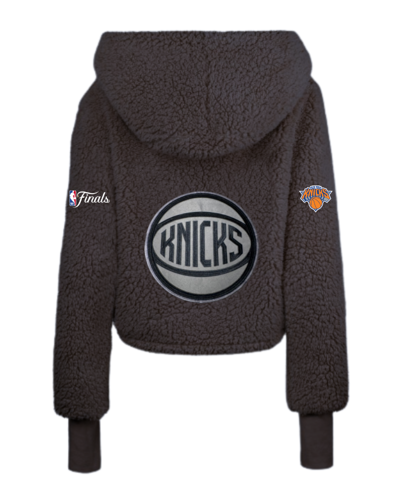 Dark brown fleece hoodie with Knicks logo and patches on a white background