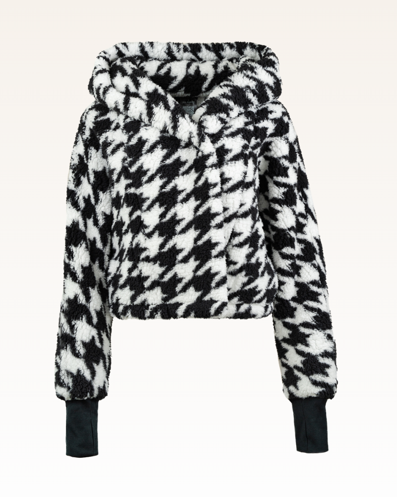 Black and white houndstooth patterned jacket on a white background