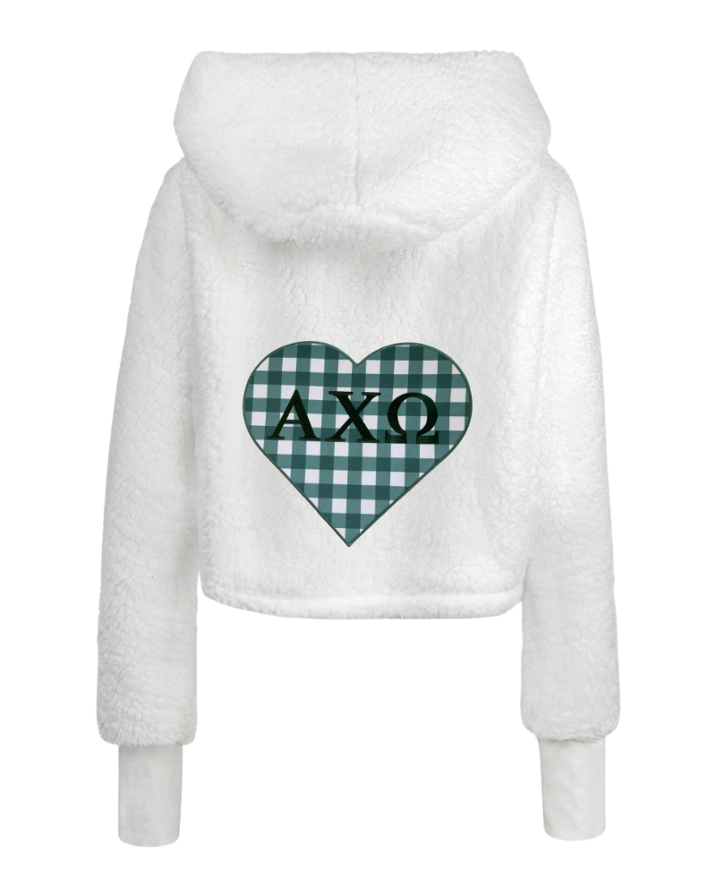 White fuzzy cropped hoodie with a green and white gingham heart on the back featuring the Greek letters 'AXΩ' in green.