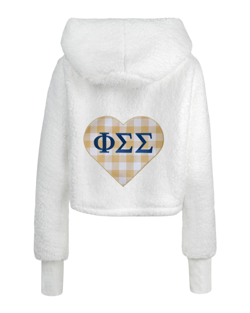 White fuzzy cropped hoodie with a heart-shaped gingham pattern on the back featuring the Greek letters Phi Sigma Sigma in navy blue.