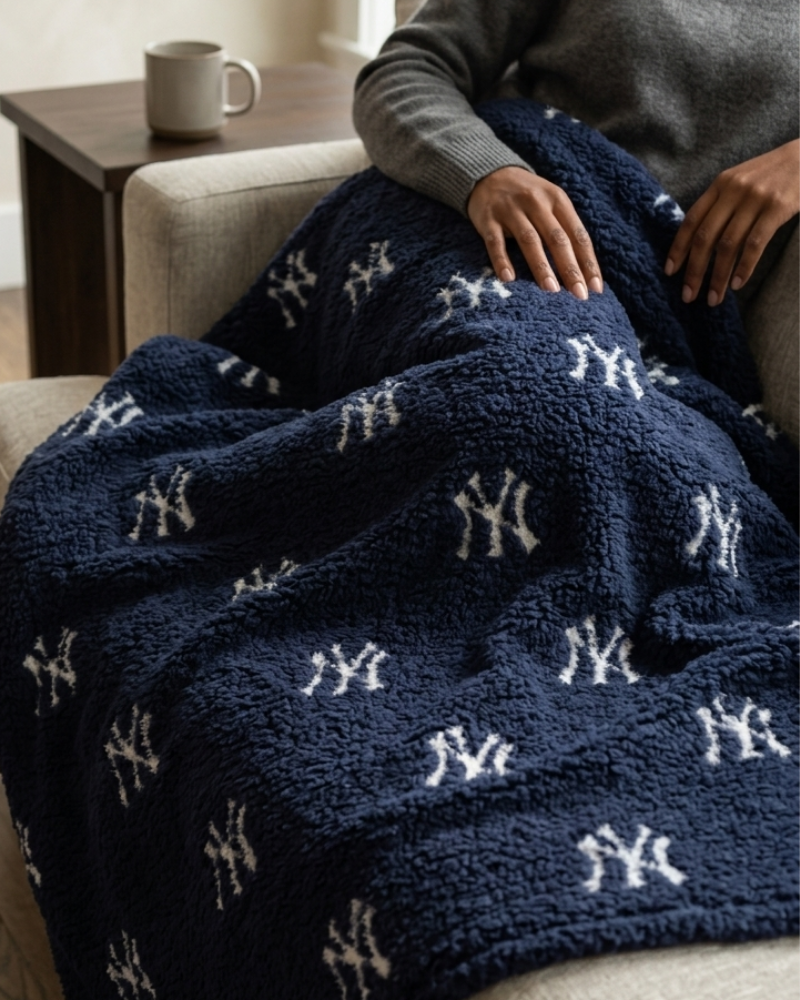 New York Yankees All Over Print 60" x 70" Sherpa Throw Blanket - Blue