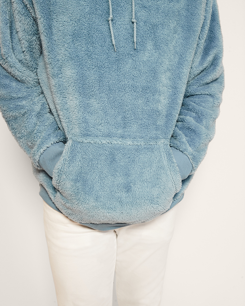 Light blue fleece hoodie on a white background