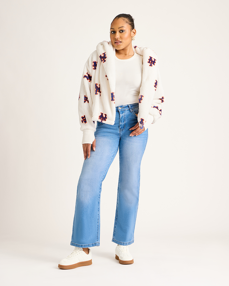 Woman wearing a floral cardigan, white top, and blue jeans on a white background|Model: 5'9" in size XS/S