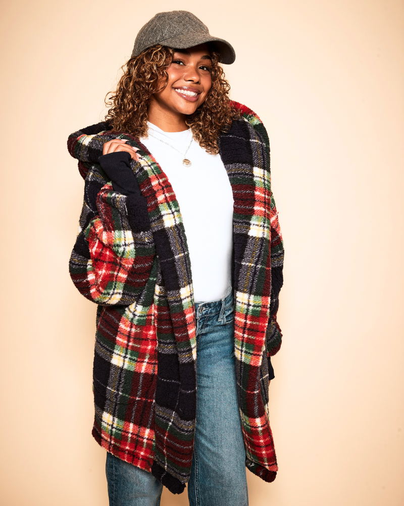 girl wearing navy plaid sherpa jacket on beige background