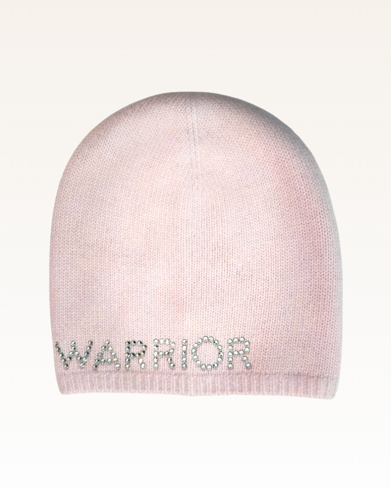 Pink beanie with 'WARRIOR' text on a white background